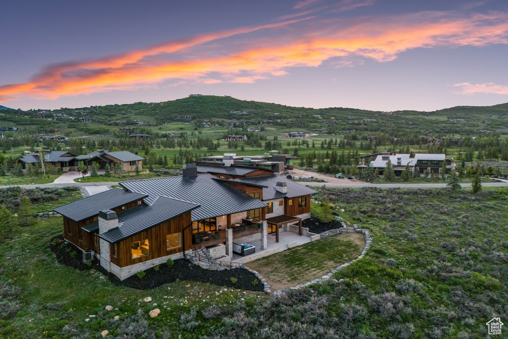 Aerial view at dusk featuring a mountain view