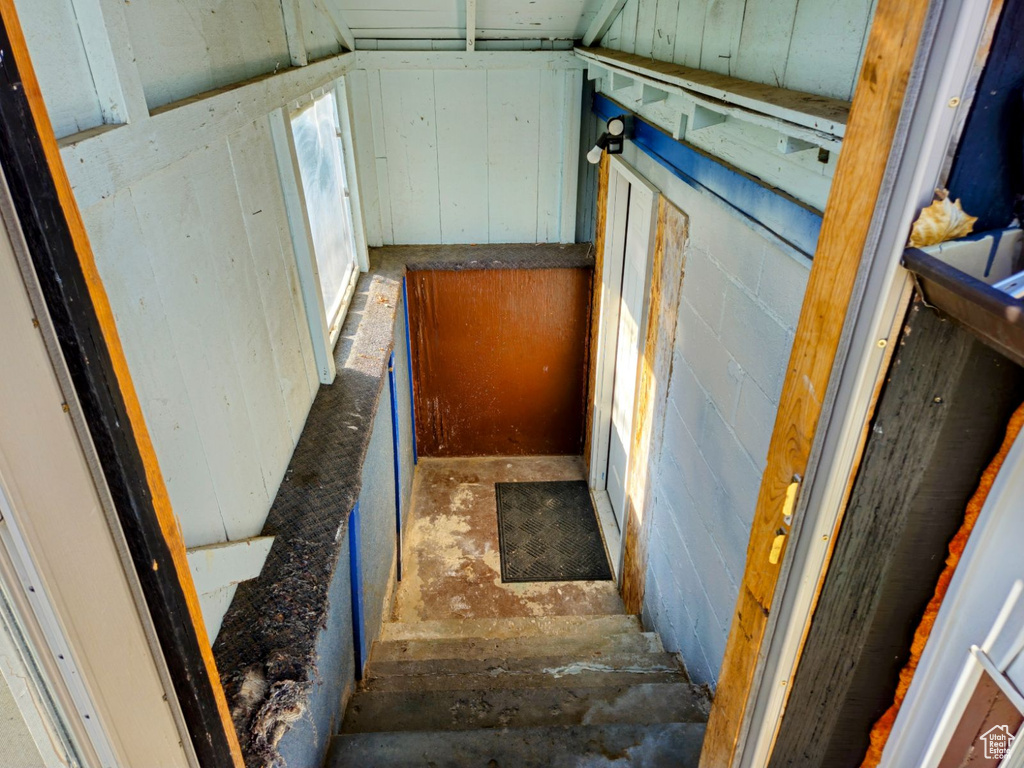 Staircase with lofted ceiling