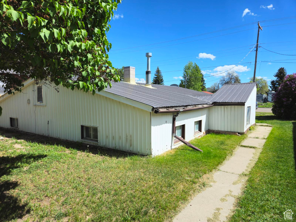 View of home\'s exterior featuring a lawn