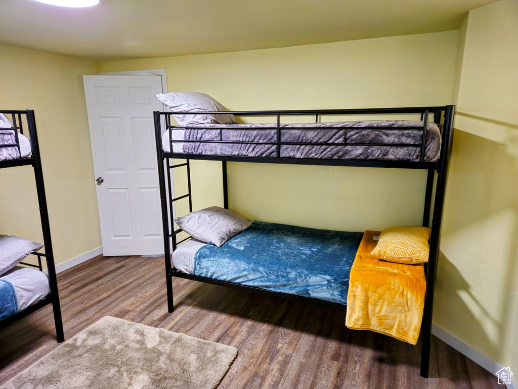 Bedroom with wood-type flooring