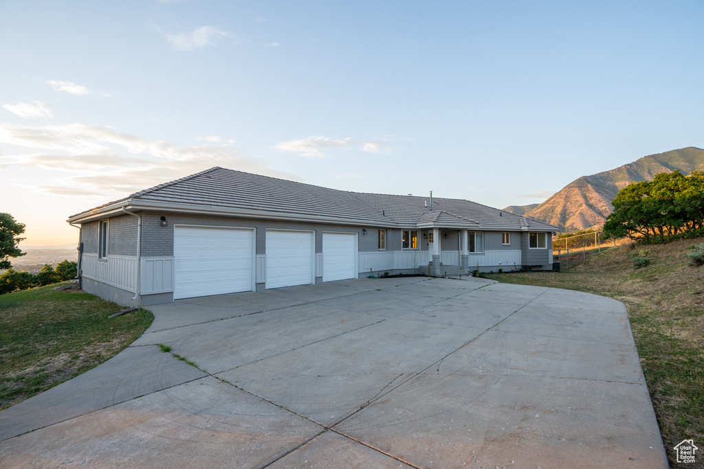 Single story home with a mountain view