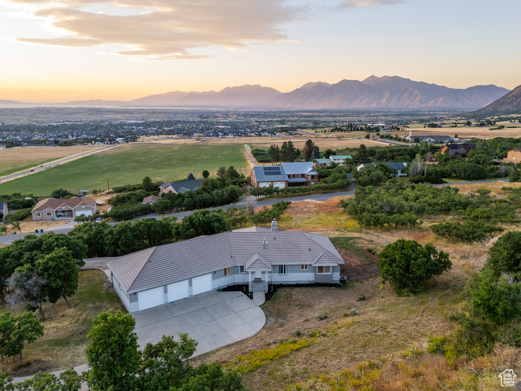 Aerial view at dusk featuring a mountain view