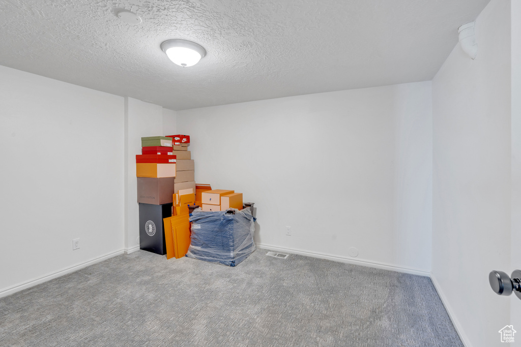 Interior space featuring a textured ceiling