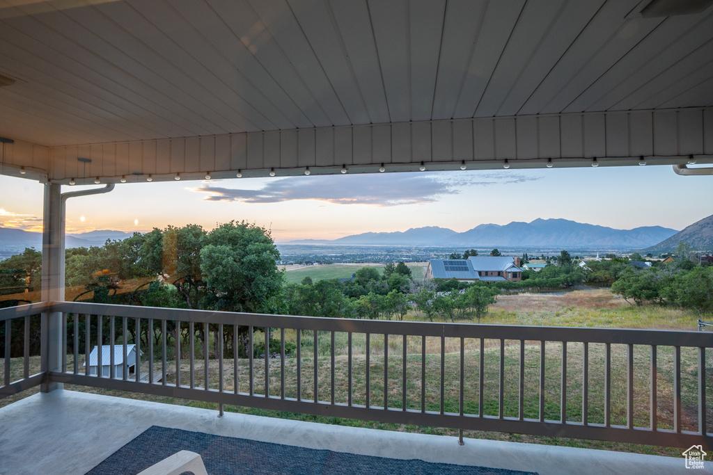 Exterior space featuring a mountain view and a balcony