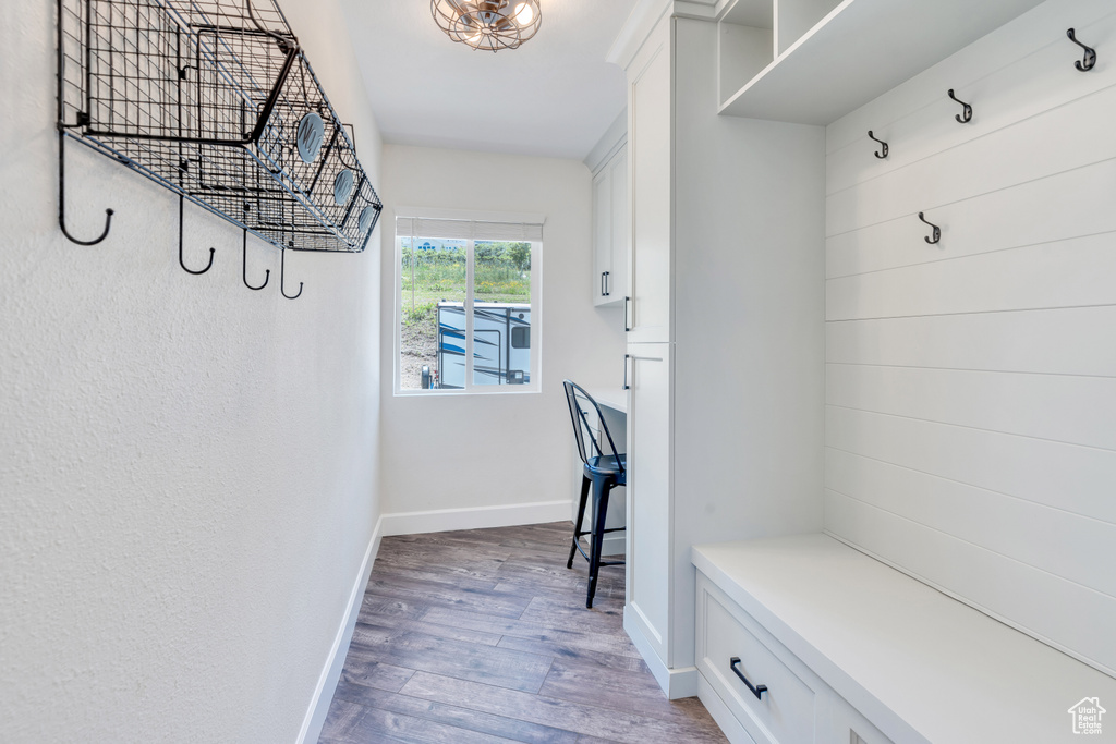 Mudroom with hardwood / wood-style flooring