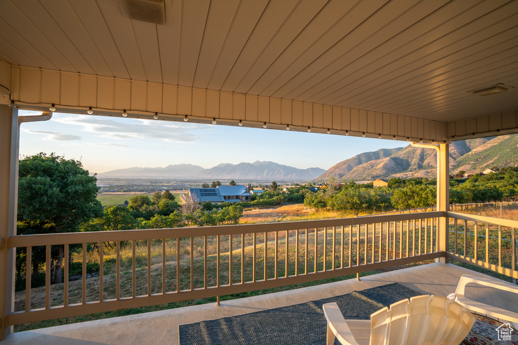 View of patio / terrace with a deck with mountain view