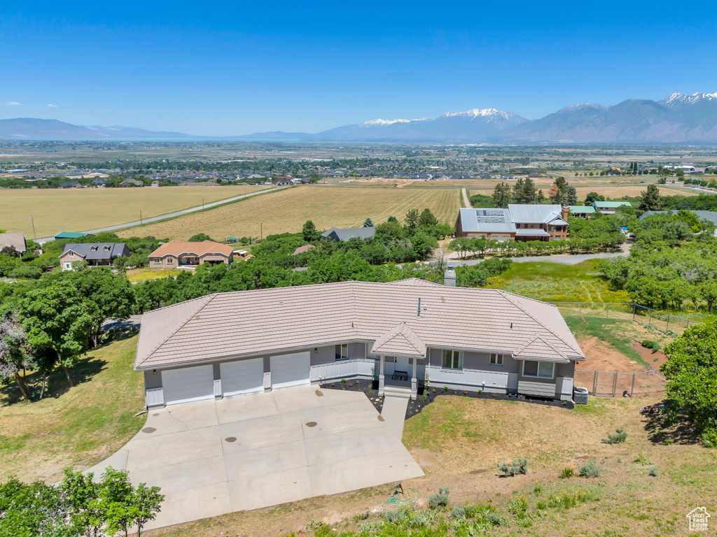 Birds eye view of property with a mountain view