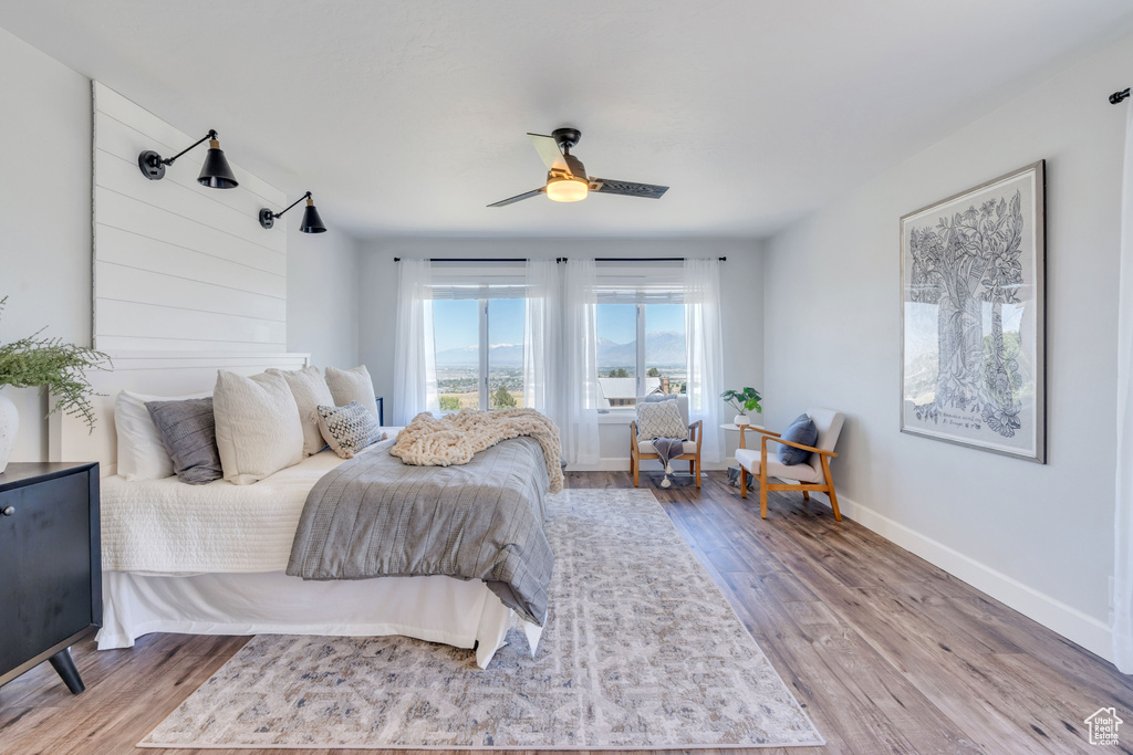 Bedroom featuring hardwood / wood-style flooring and ceiling fan