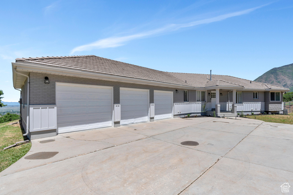 Exterior space with a garage and covered porch