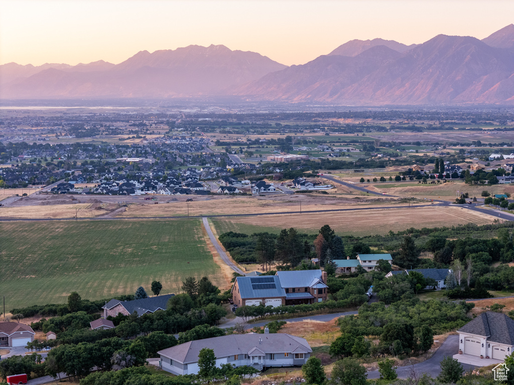 Aerial view at dusk featuring a mountain view