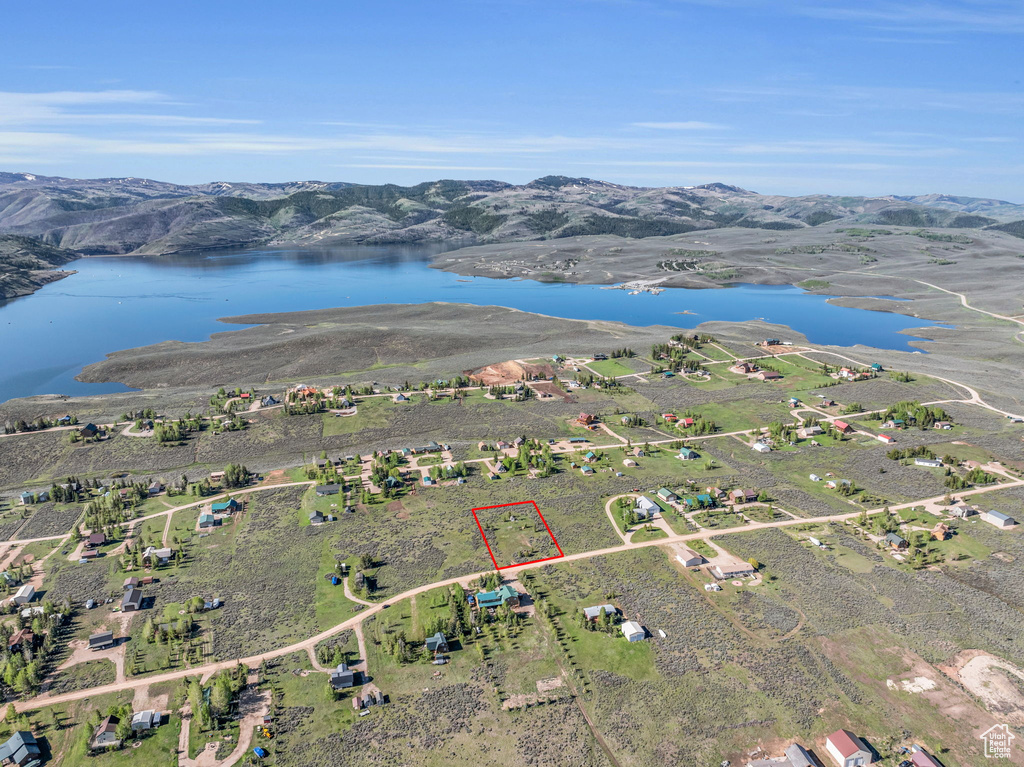 Aerial view featuring a water and mountain view