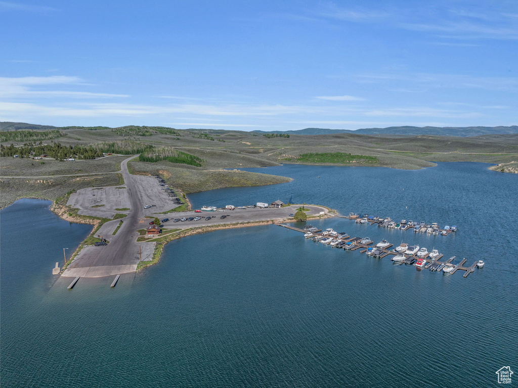 Birds eye view of property featuring a water view