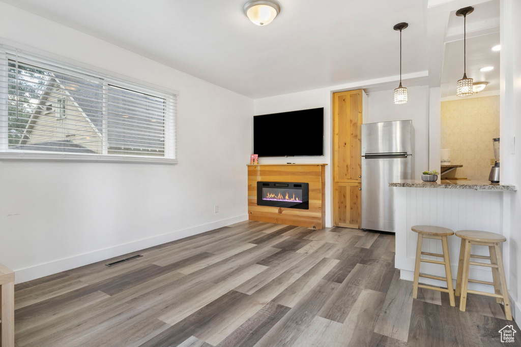 Unfurnished living room with dark hardwood / wood-style flooring