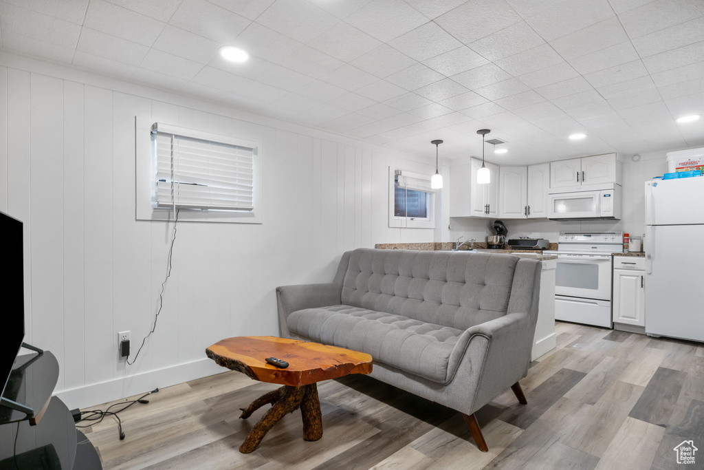 Living room with light wood-type flooring