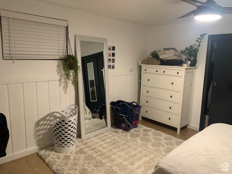 Bedroom with wood-type flooring, a closet, and ceiling fan