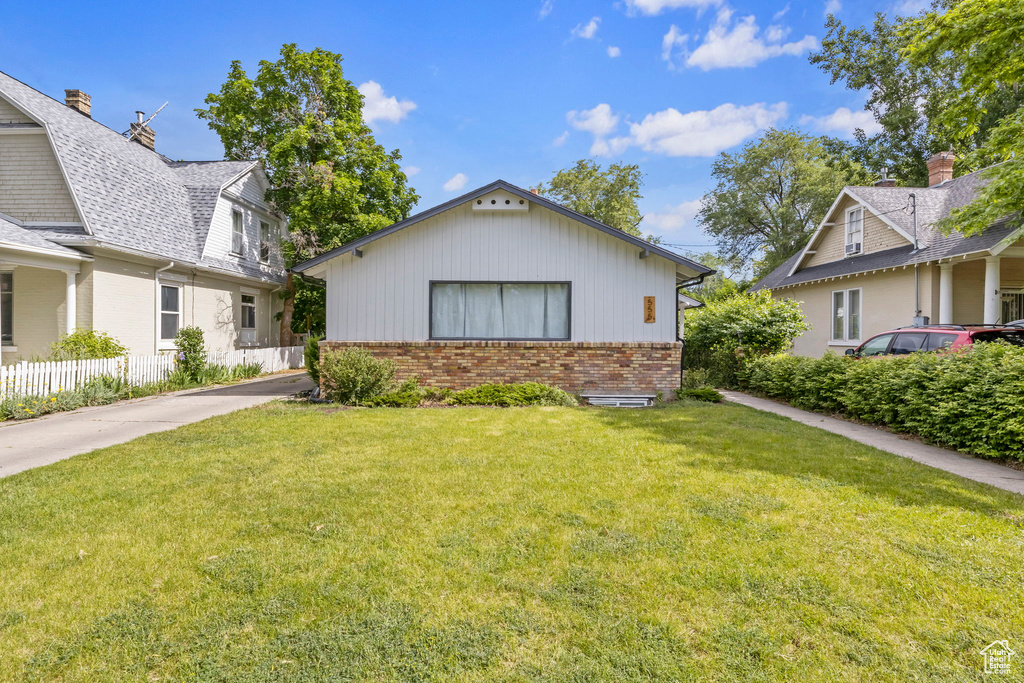 View of front of property with a front lawn