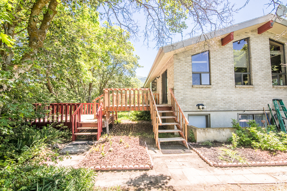 View of yard featuring a wooden deck