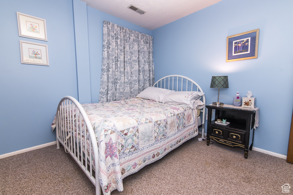 Bedroom featuring carpet flooring