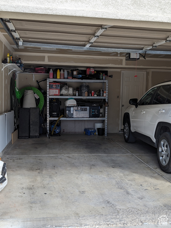 Garage featuring a garage door opener