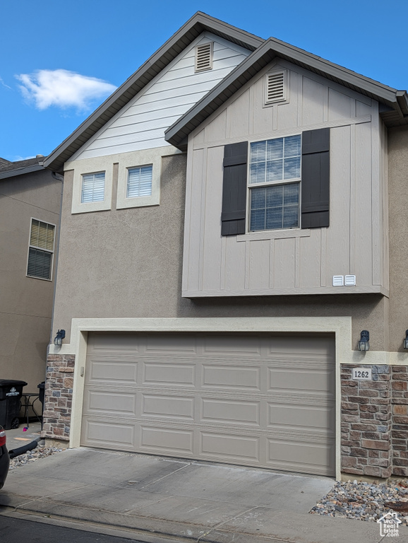 View of front of property with a garage