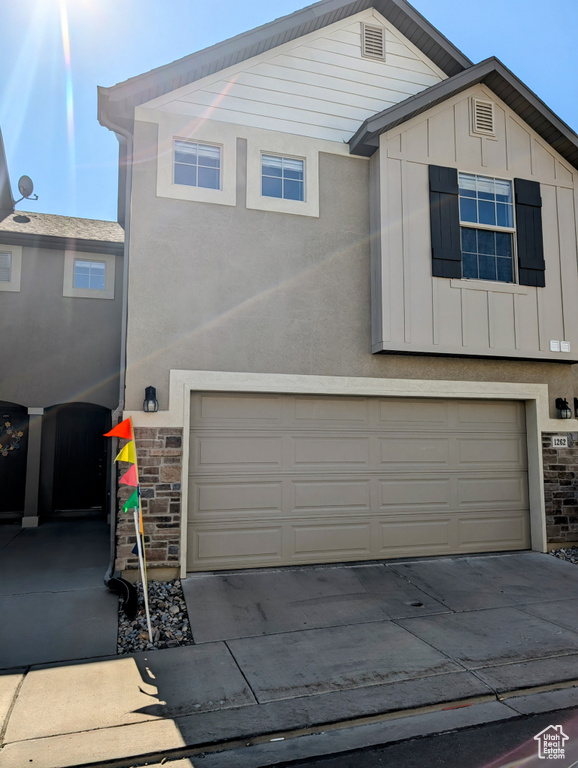 View of front of property featuring a garage