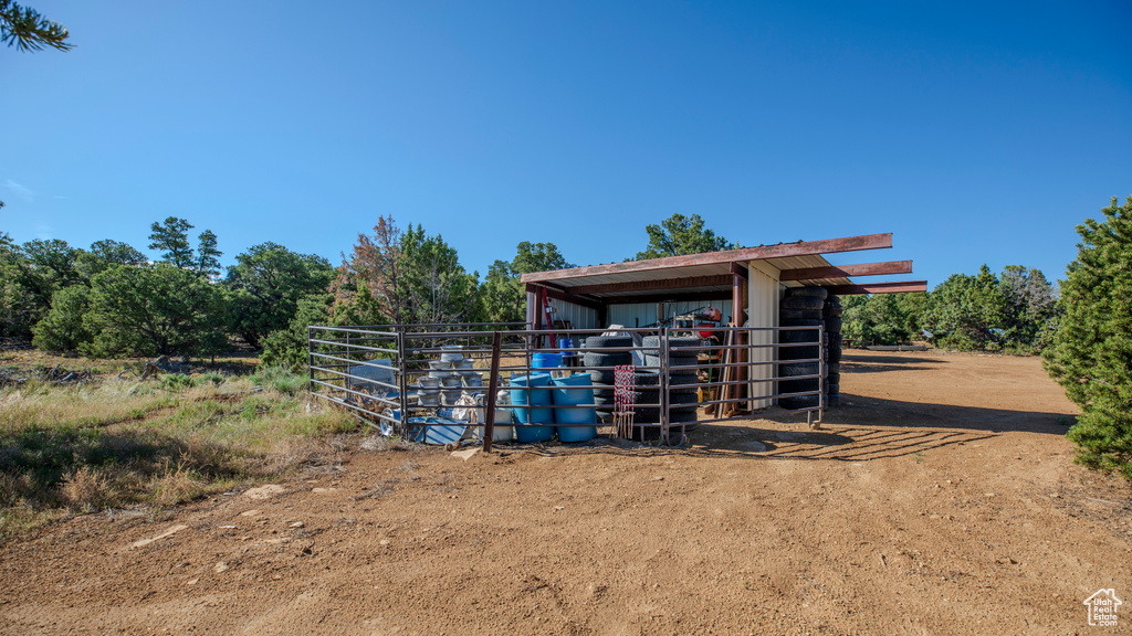 View of shed / structure with a rural view