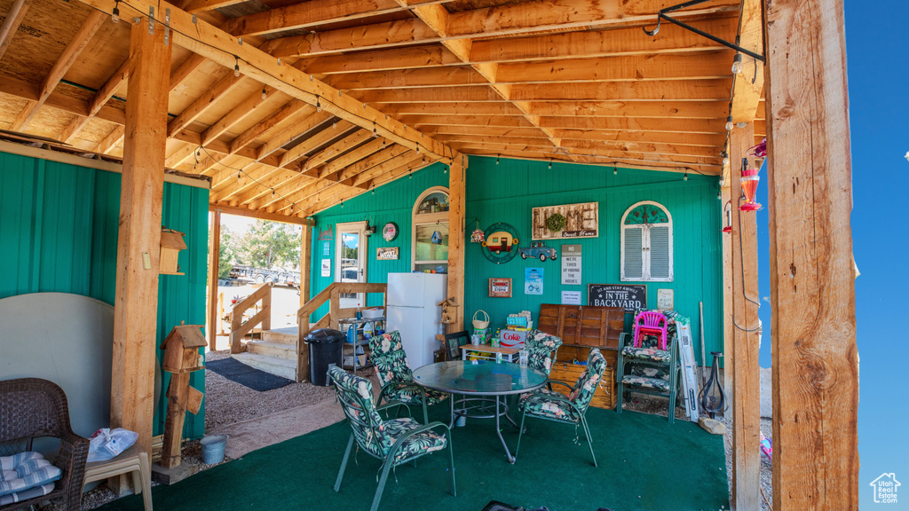 Dining room with lofted ceiling