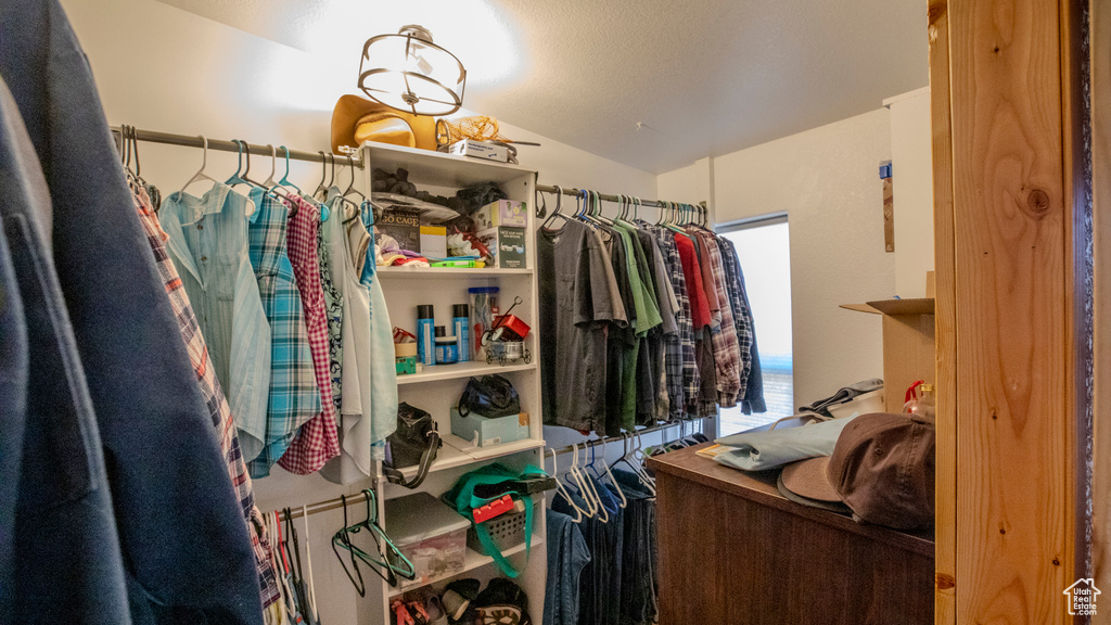 Walk in closet with vaulted ceiling