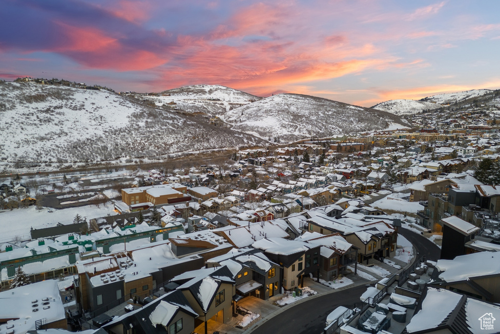 Snowy aerial view featuring a mountain view