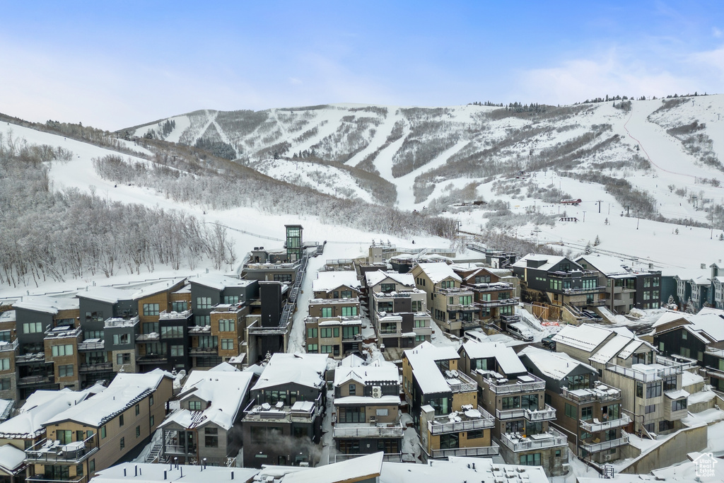 Snowy aerial view featuring a mountain view