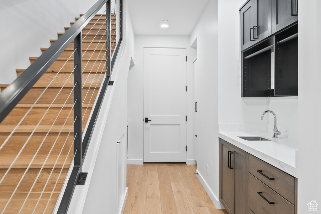 Interior space featuring wood-type flooring and sink