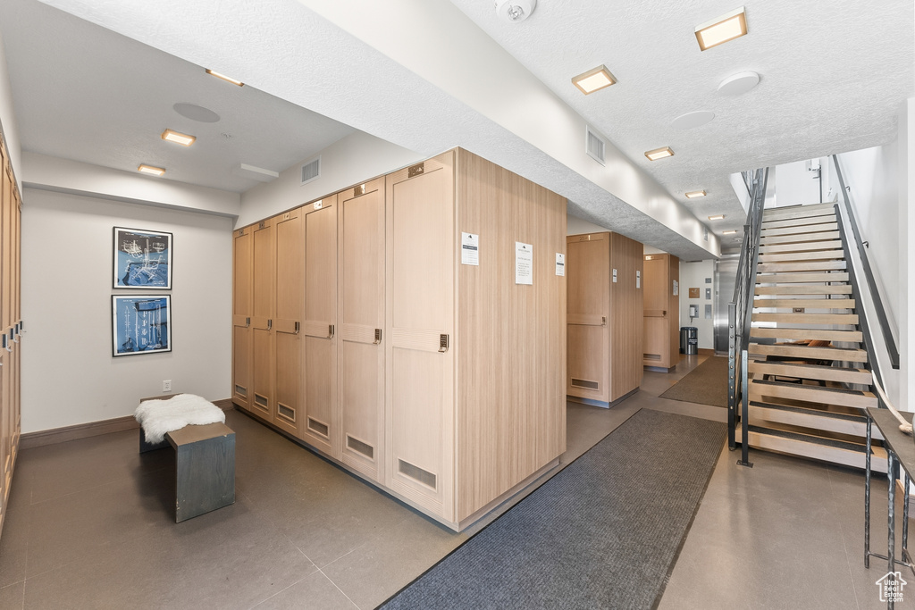 Interior space featuring a textured ceiling