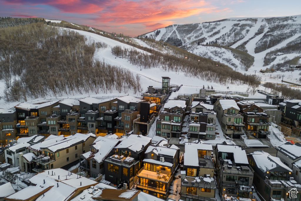 Snowy aerial view featuring a mountain view