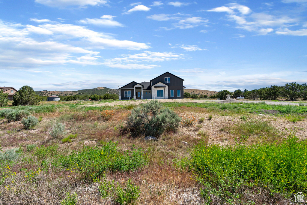 View of front facade with a rural view