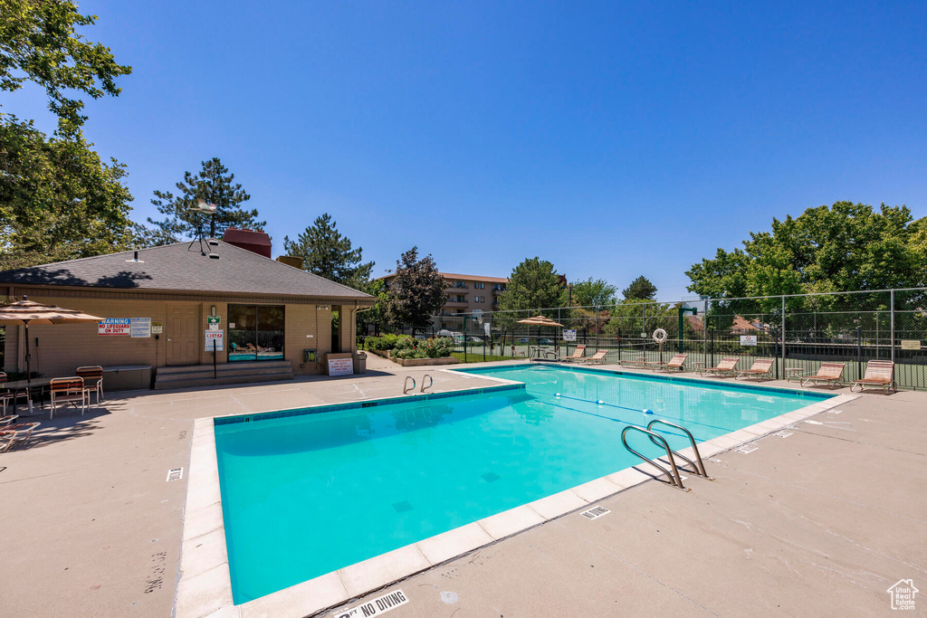 View of swimming pool with a patio area