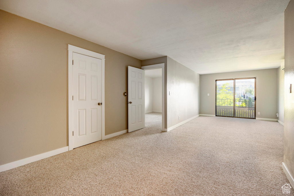 Spare room featuring carpet