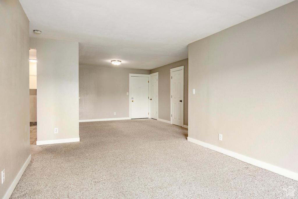 Unfurnished room featuring carpet flooring