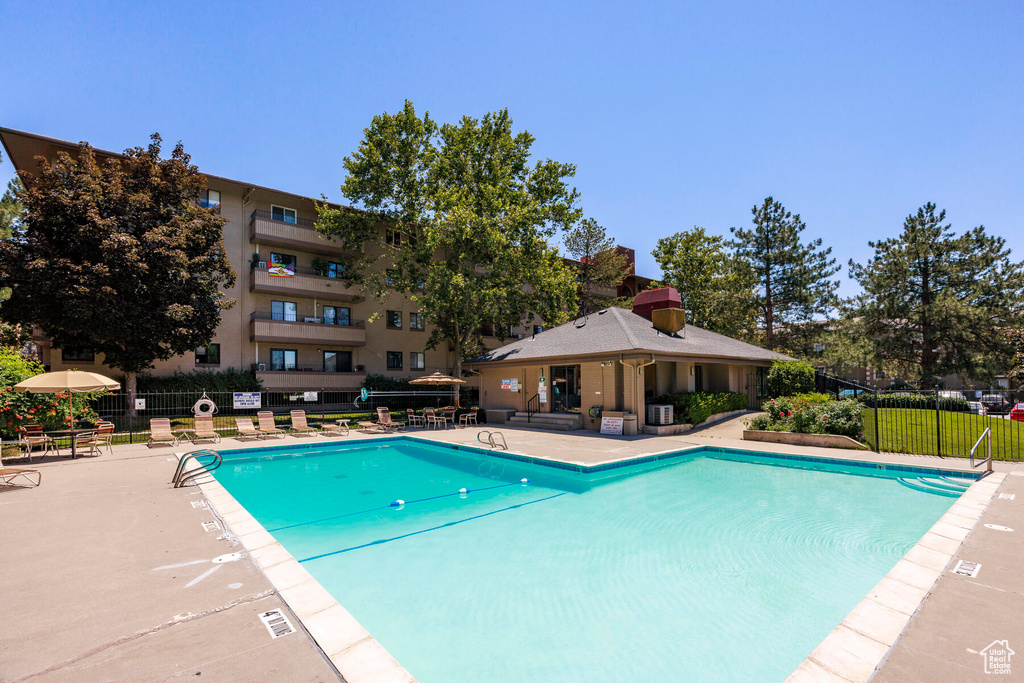 View of pool featuring central air condition unit