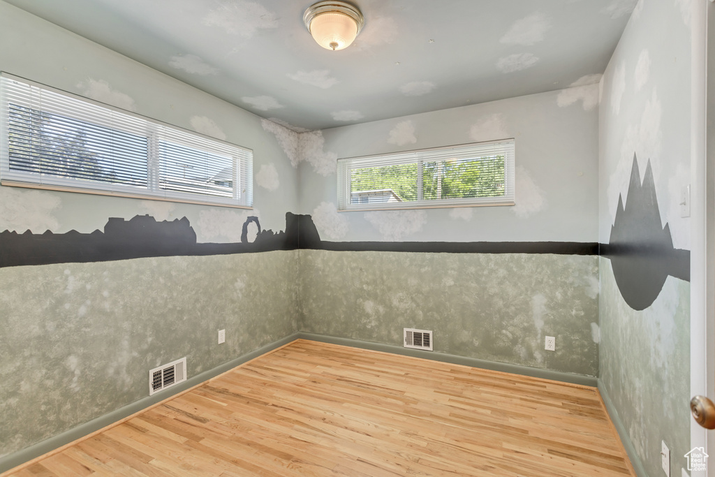 Spare room with wood-type flooring