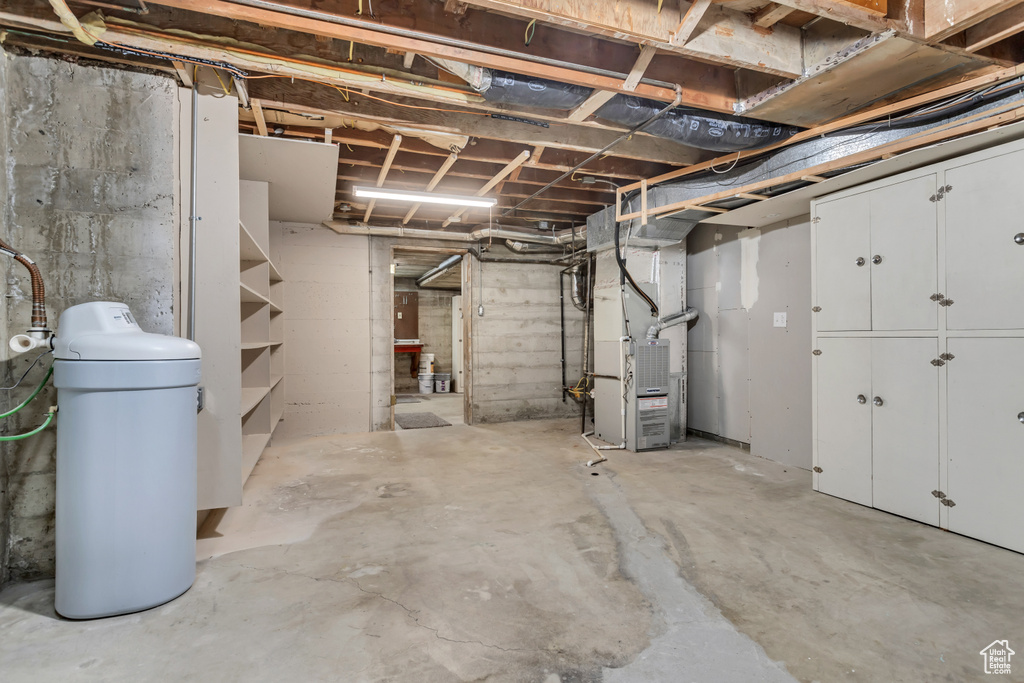 Basement featuring heating utilities