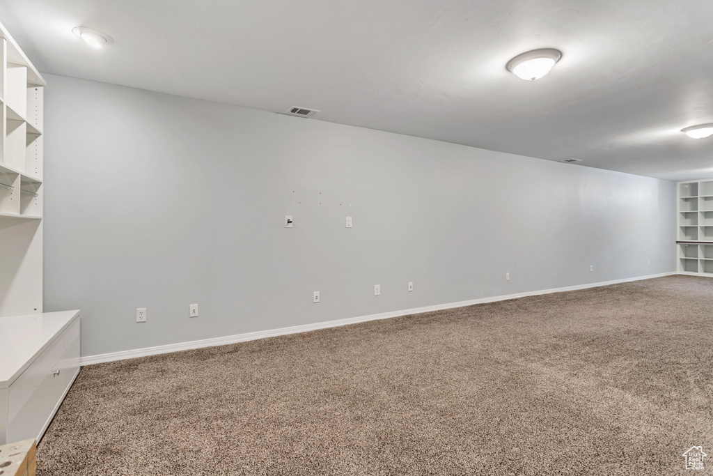 Empty room with carpet flooring