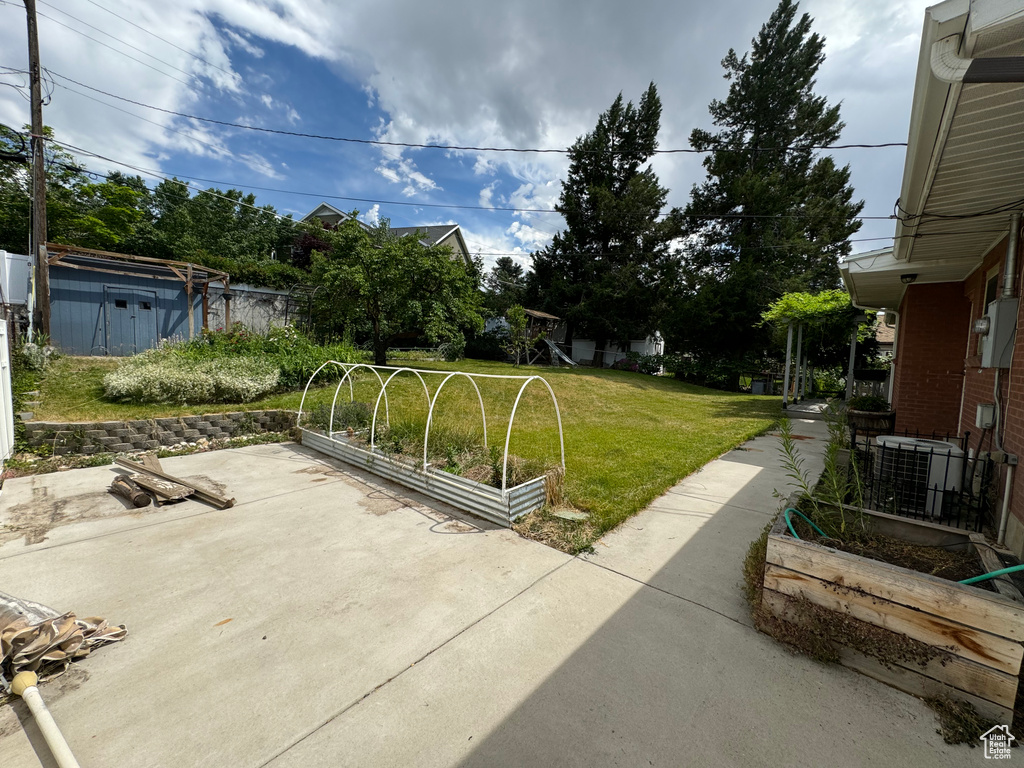 View of terrace featuring an outdoor structure and central AC unit