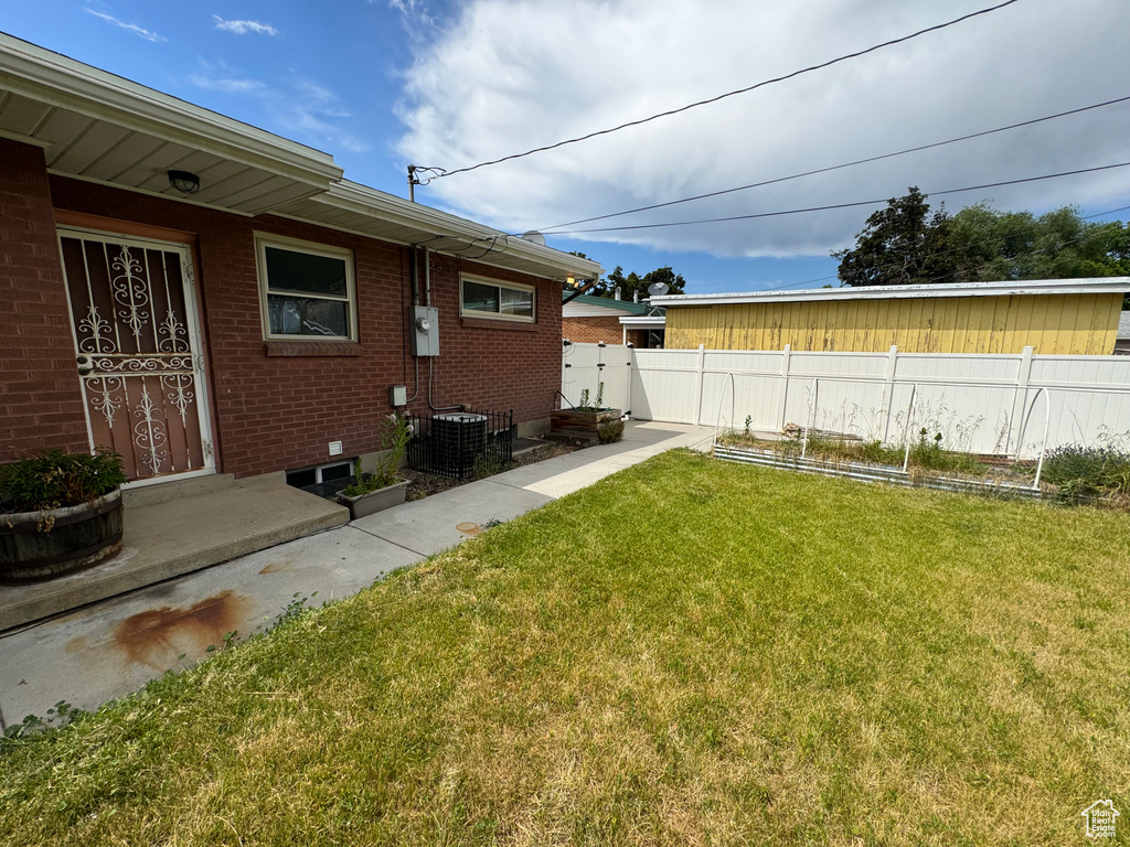 View of yard with central AC unit