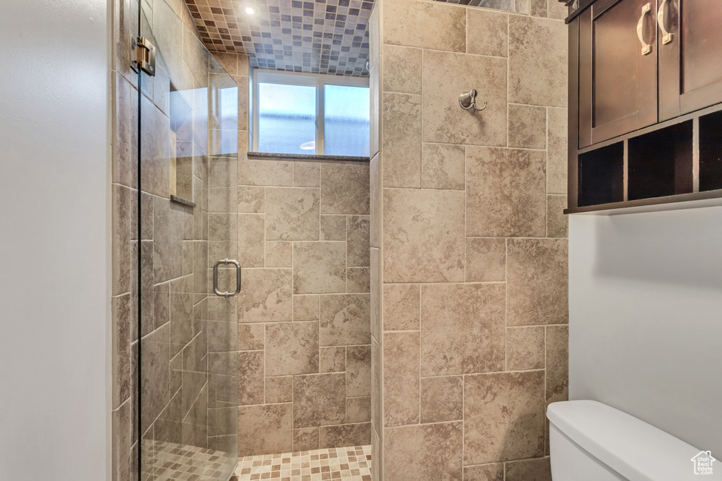 Bathroom with an enclosed shower and toilet