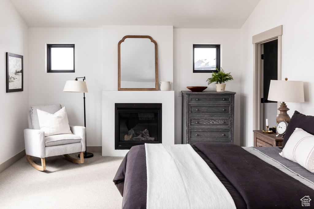 Bedroom featuring carpet and lofted ceiling