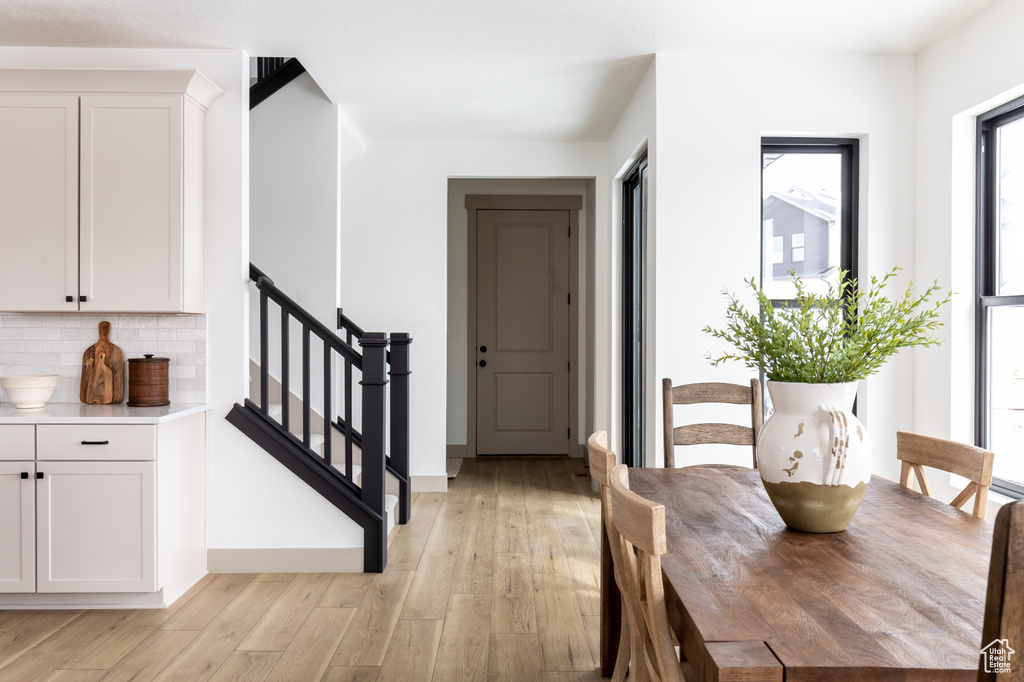 Foyer with light hardwood / wood-style flooring