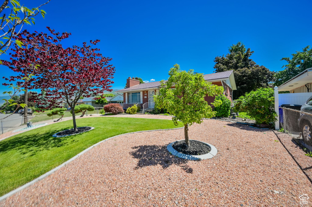 Exterior space featuring a front lawn