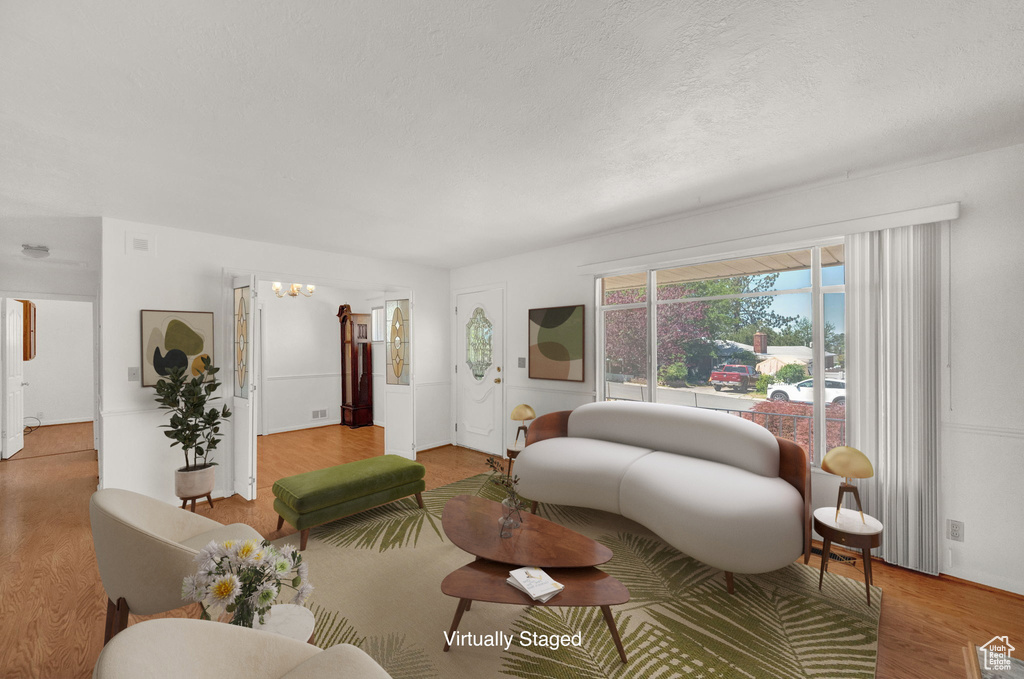 Living room with hardwood / wood-style flooring