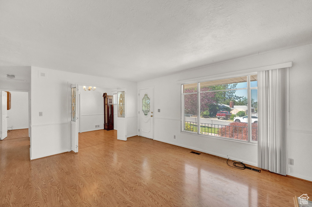 Unfurnished room with light hardwood / wood-style floors