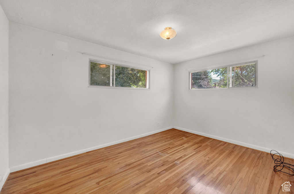 Empty room featuring light hardwood / wood-style flooring